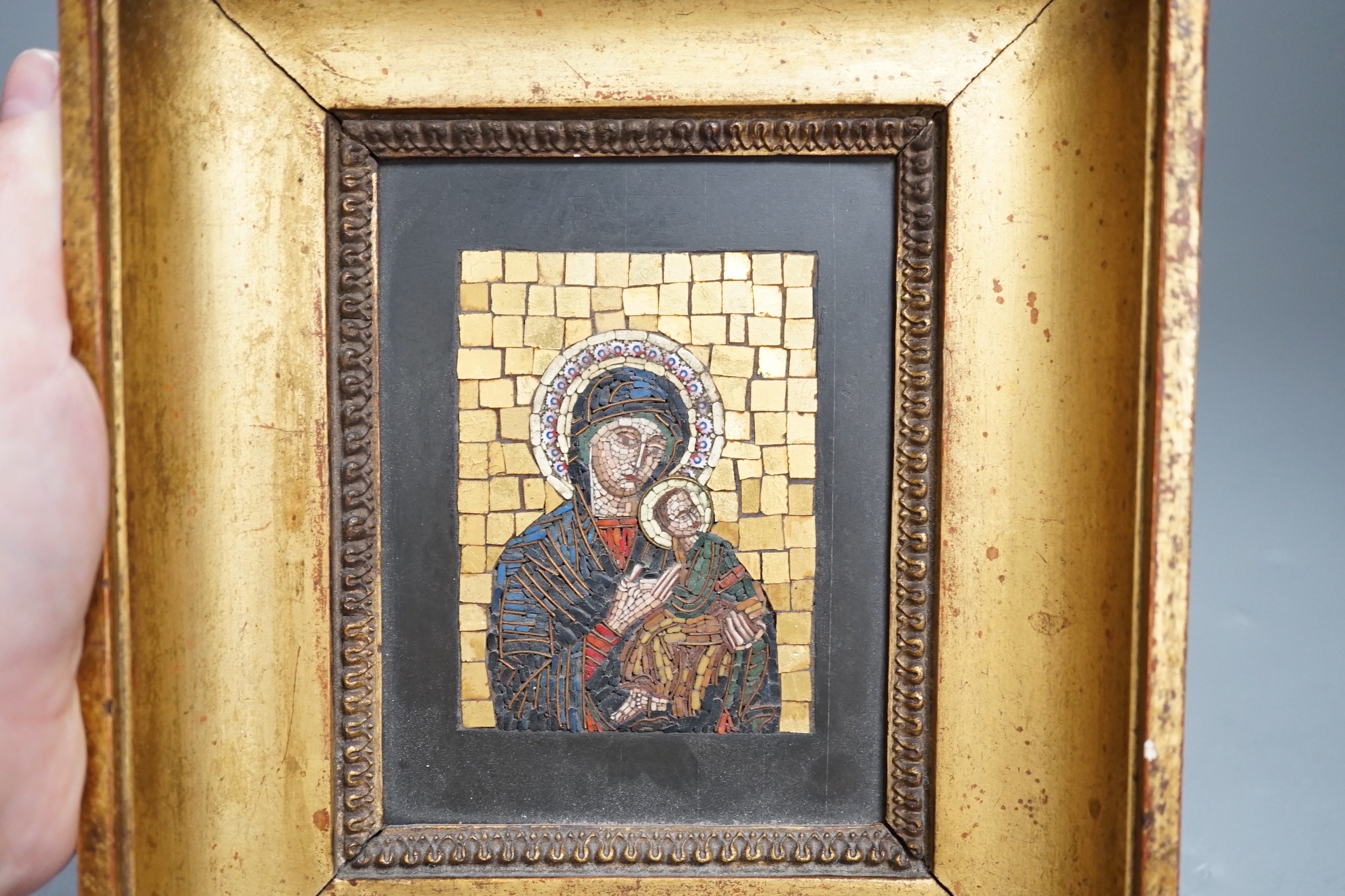 An early 20th century micro mosaic, ‘madonna del perpetuo soccorso’ framed with Vatican label verso, 19x17cm including frame